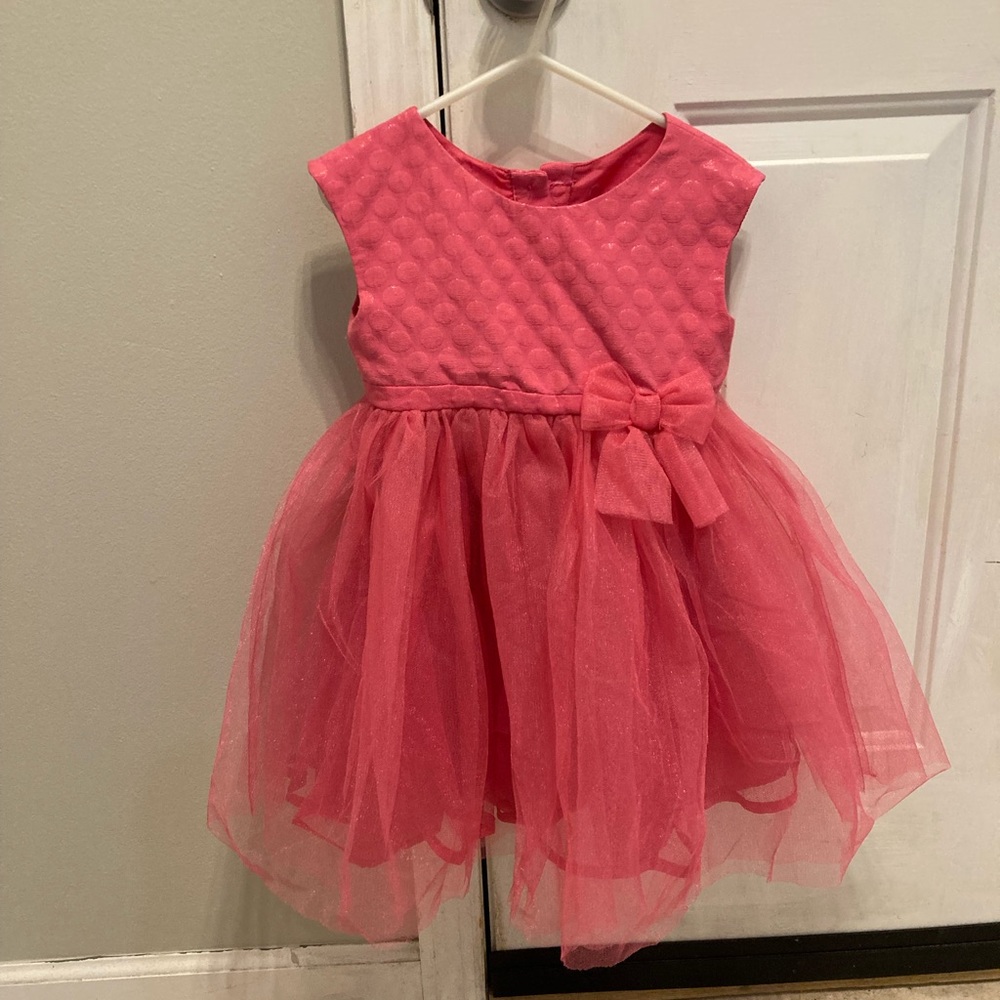 Hot pink girls dress with tulle skirt.